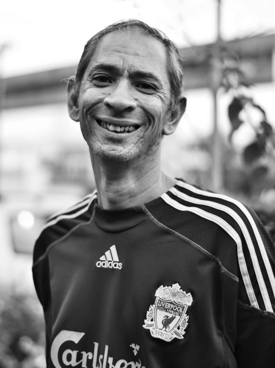 a man smiles as he poses for a po