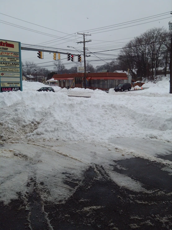 a couple of cars on a snowy road