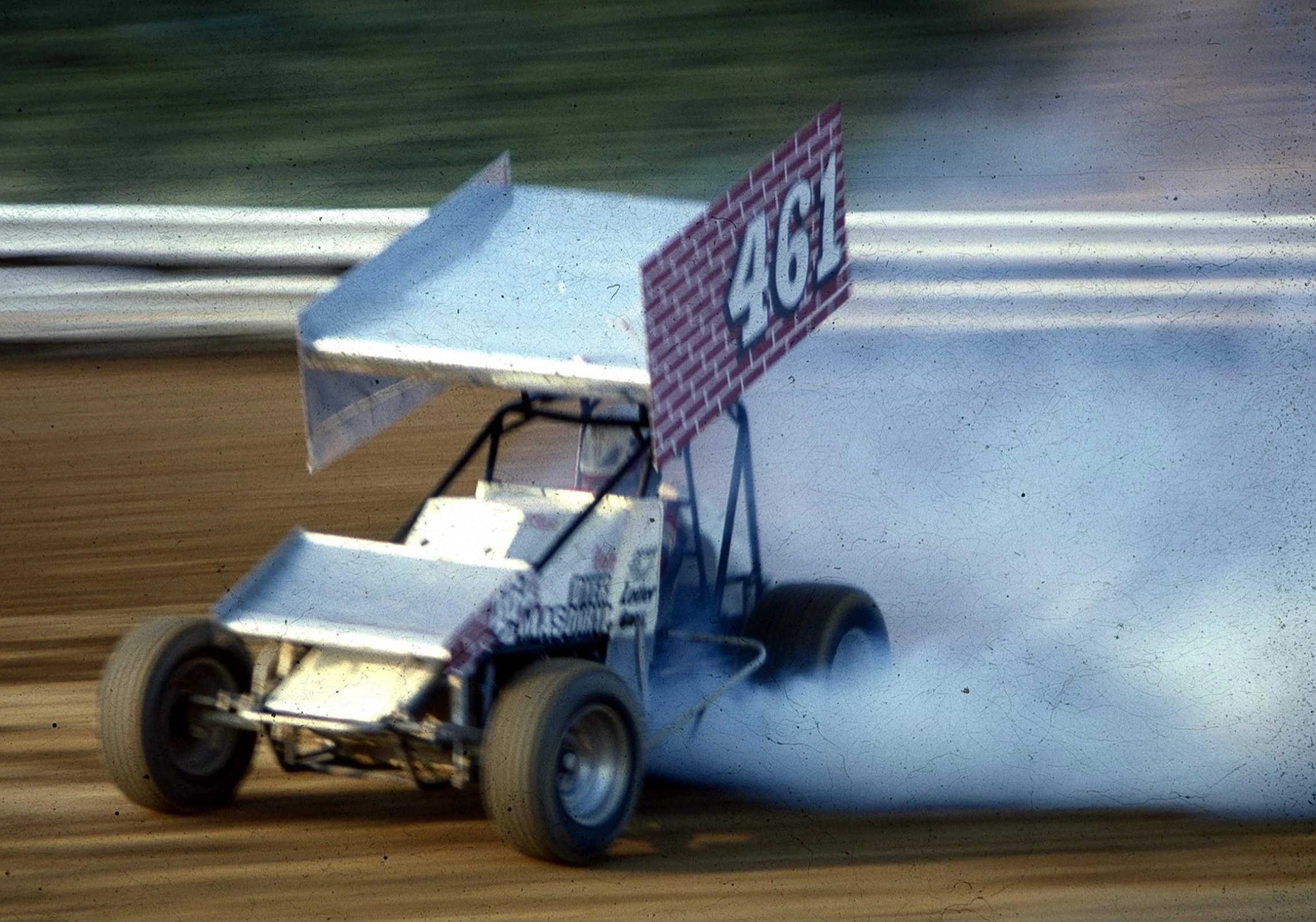 a man driving a buggy around a corner