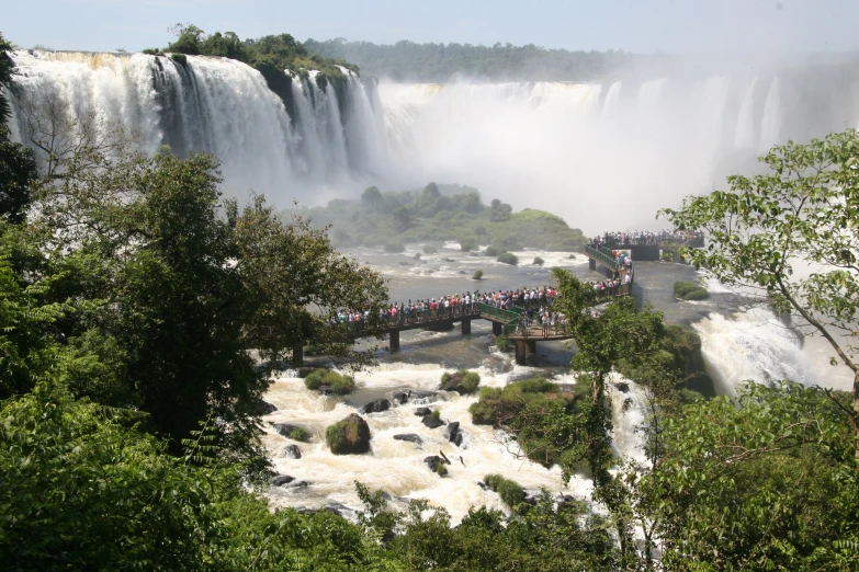 an image of a group of people at a waterfall