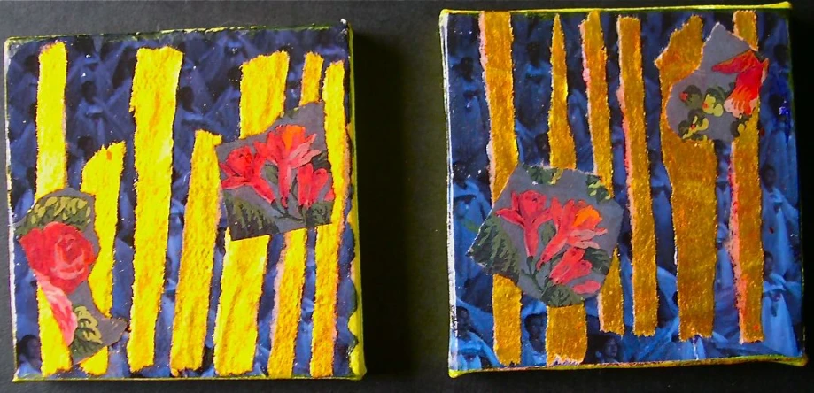 a close up of two paintings of flowers on a table