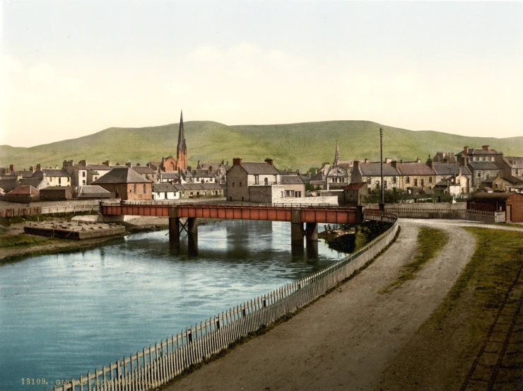 a old picture of a bridge with buildings and water