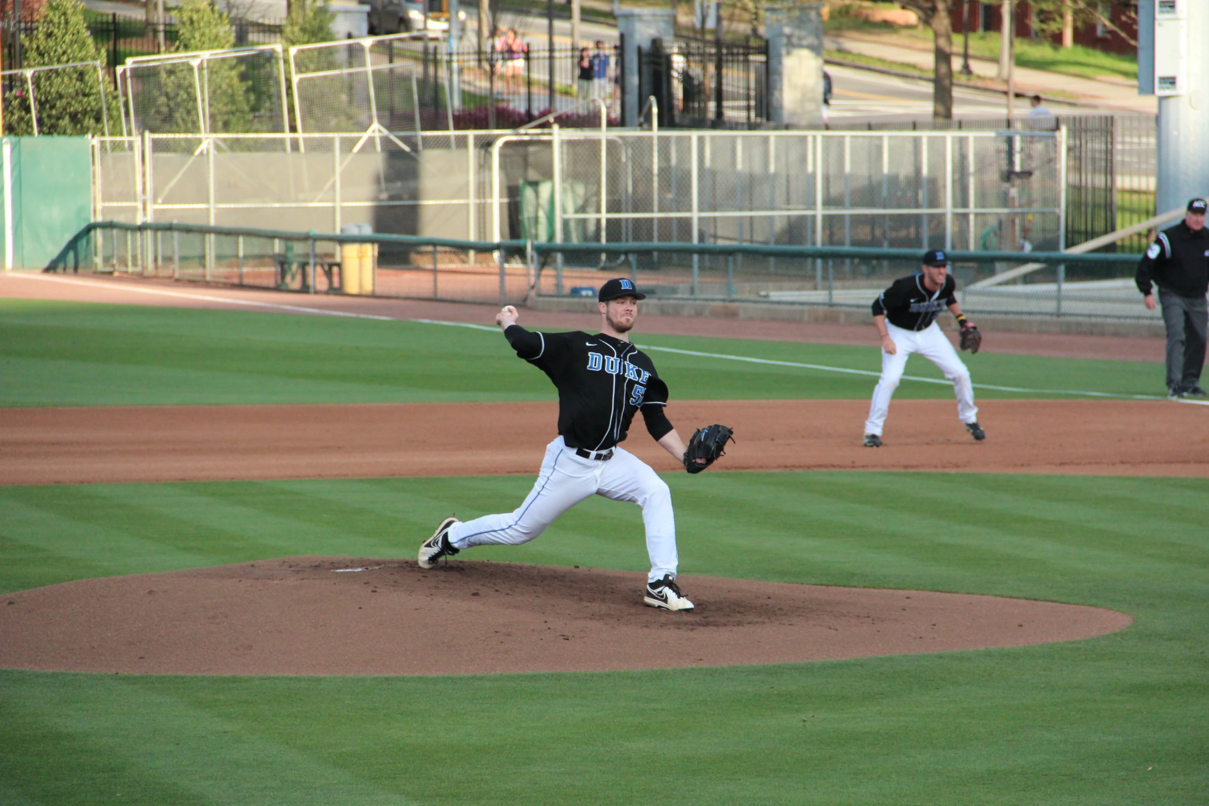 there are several baseball players playing a game on the field