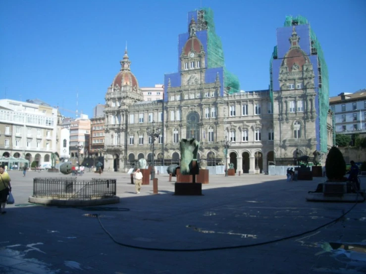 a big building that has a fountain in front of it