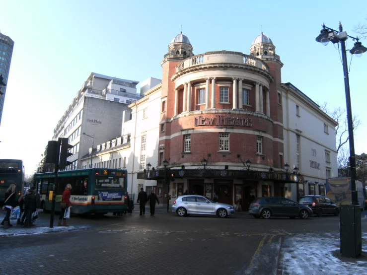 the street is busy in front of many stores