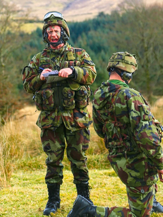 a group of men in camouflage wearing uniforms