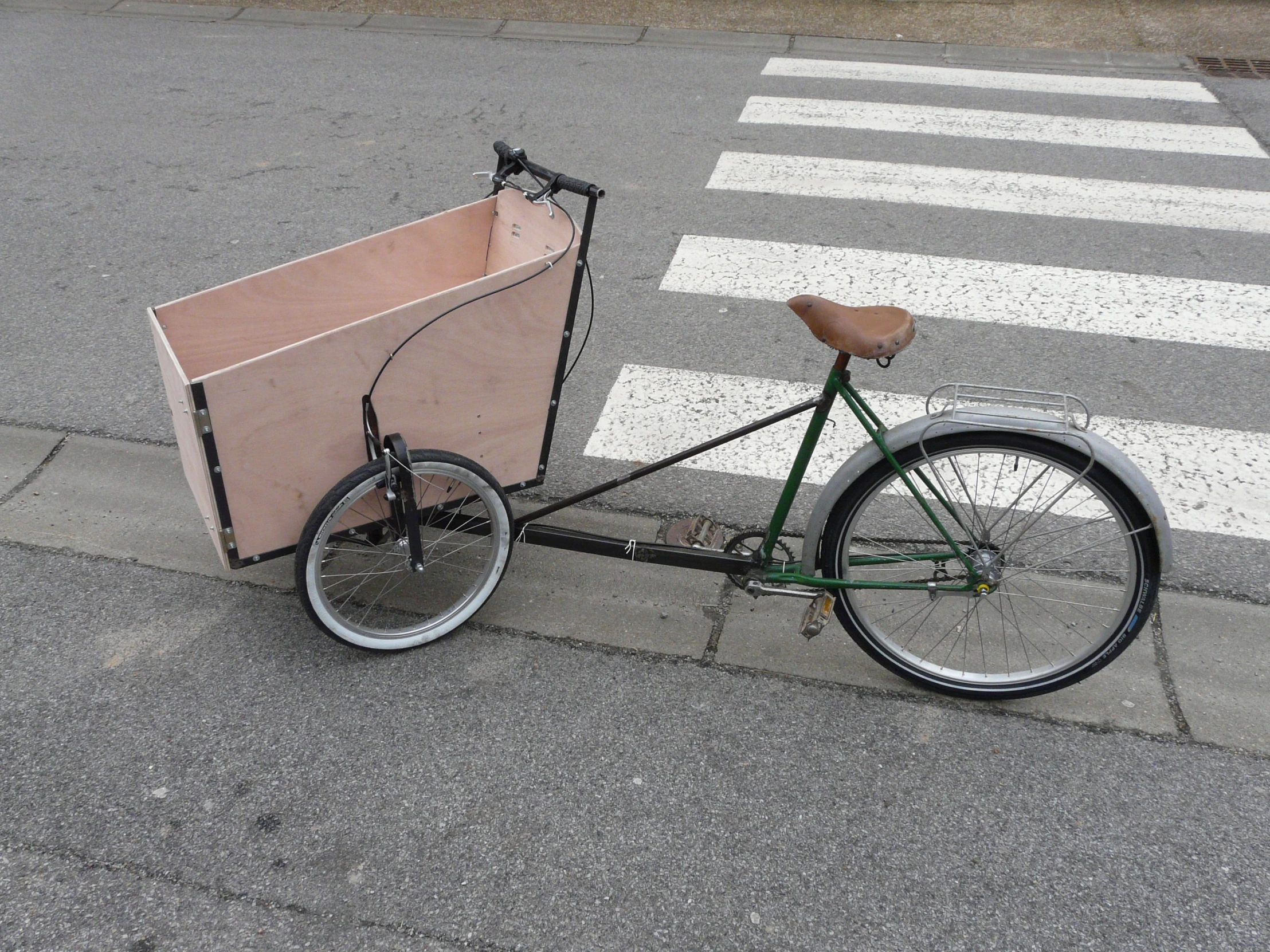 a bike that has a large box strapped to it