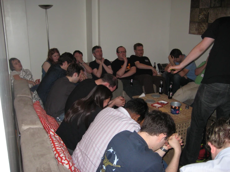 a group of people sitting in a room with drinks