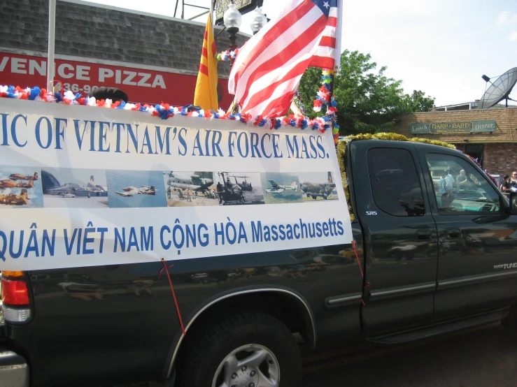 a pickup truck has a huge banner for an air force base