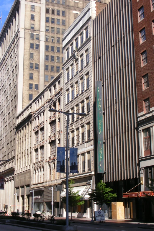 a tall building in an old city with a street sign