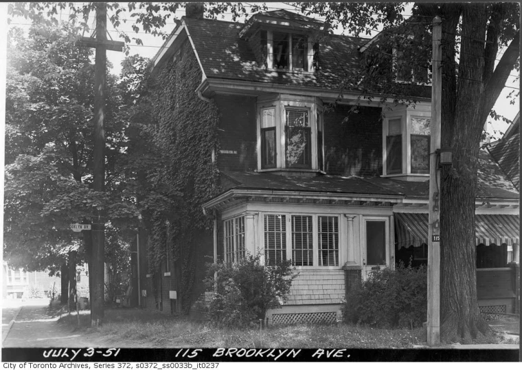 an old, antique house with ivy growing around the windows