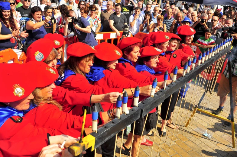 some people dressed in red, blue and yellow