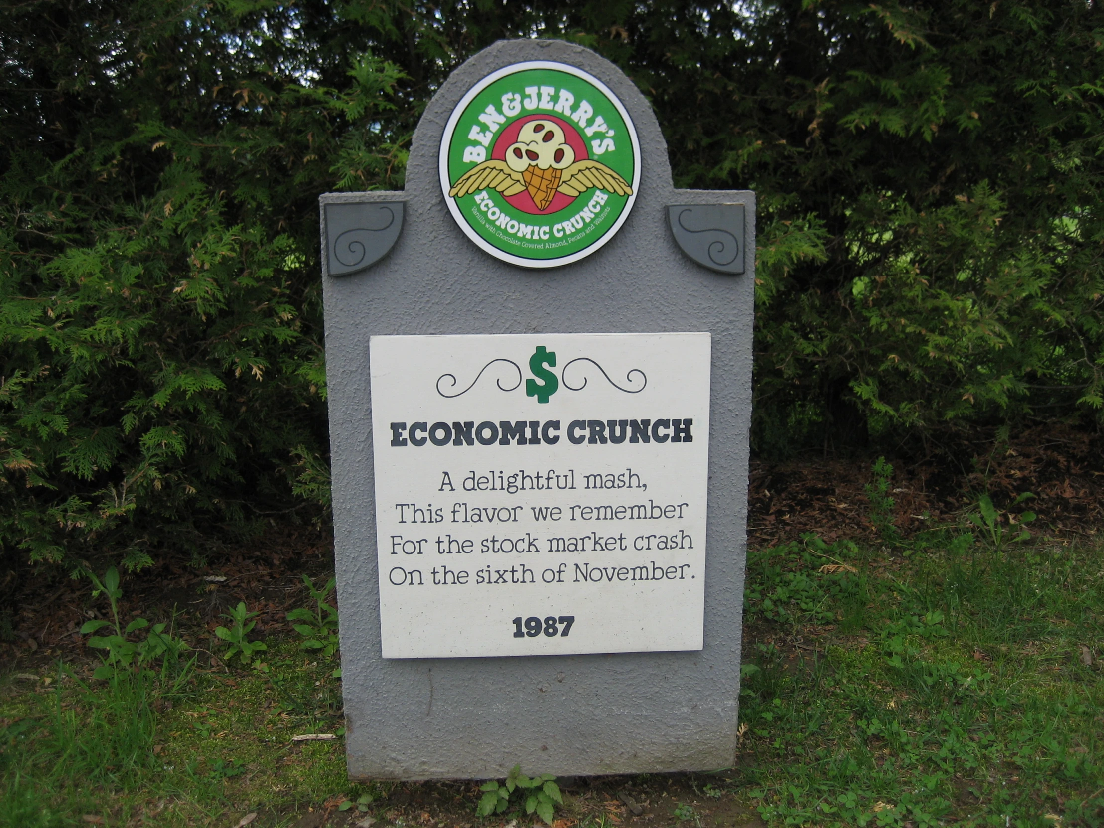 a sign stating the koronic crush in front of trees