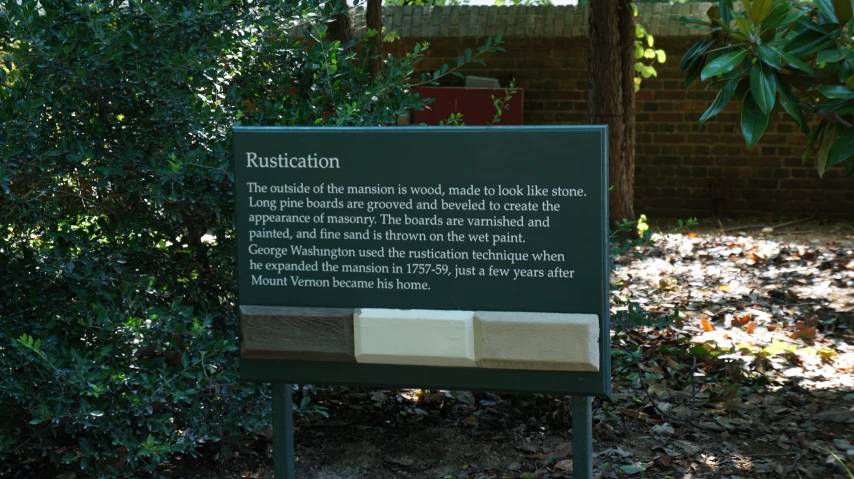 a sign points out the description of a building