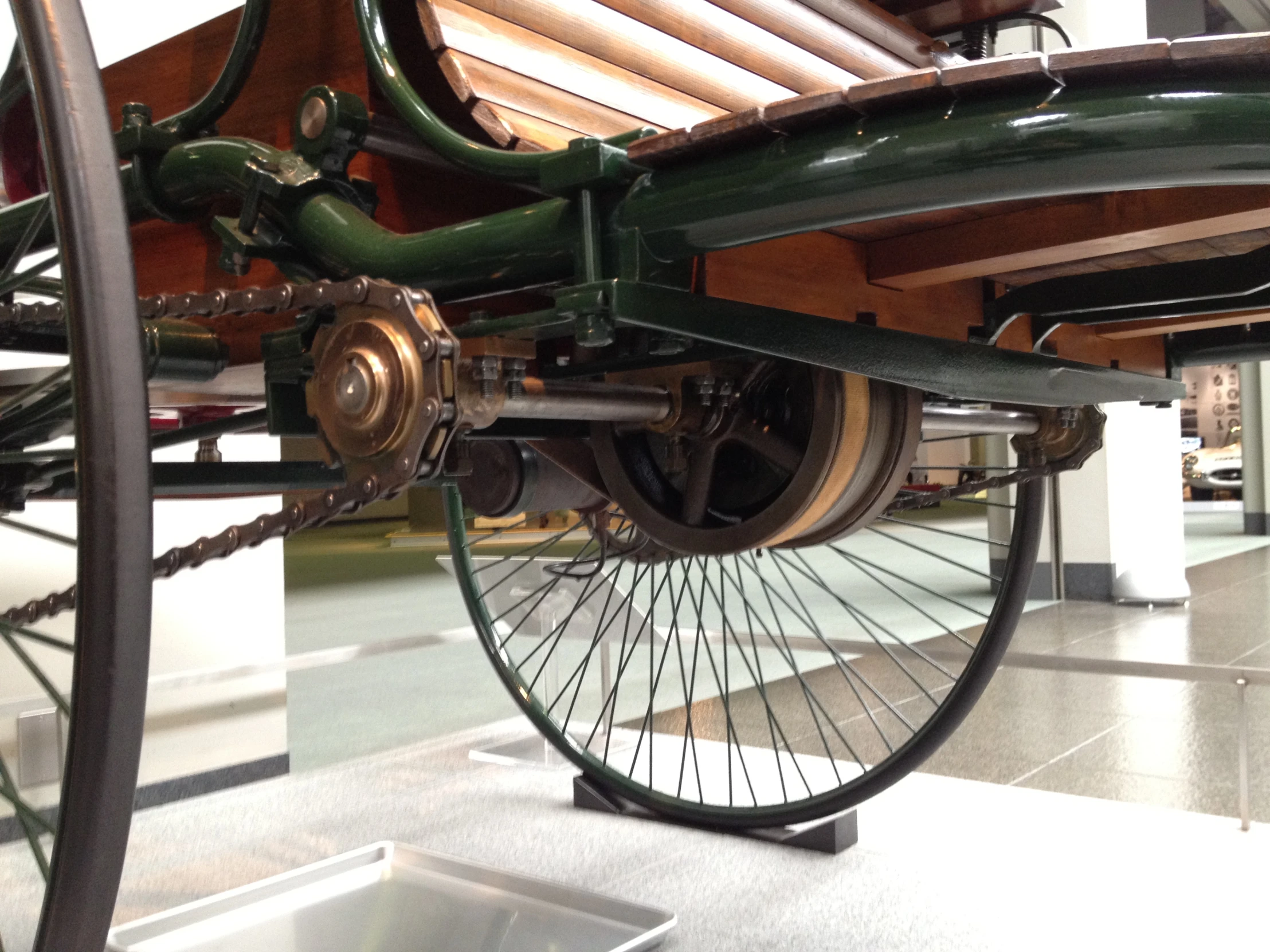 an old fashioned bicycle sitting inside a museum