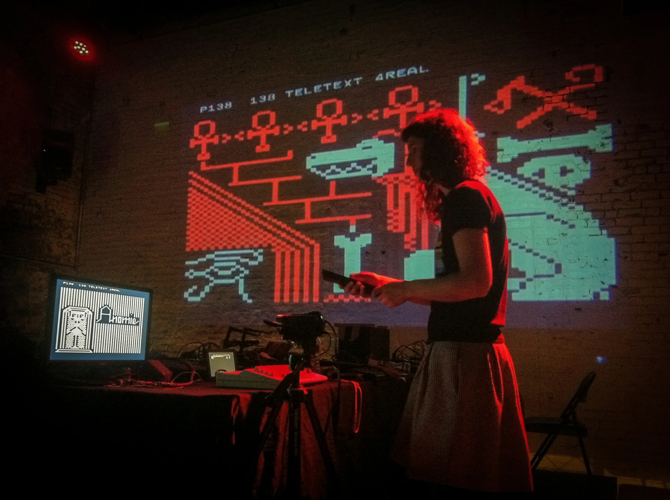 woman using a projector in front of large screen