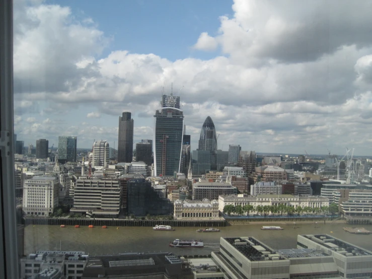 looking out of the window at some big buildings