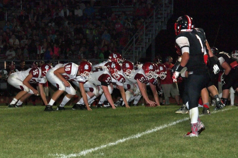 a football game with a line of people on the field