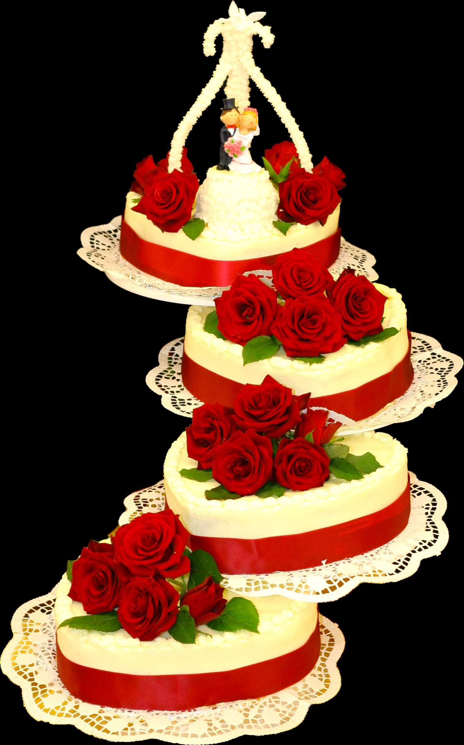 a triple layer cake topped with red roses