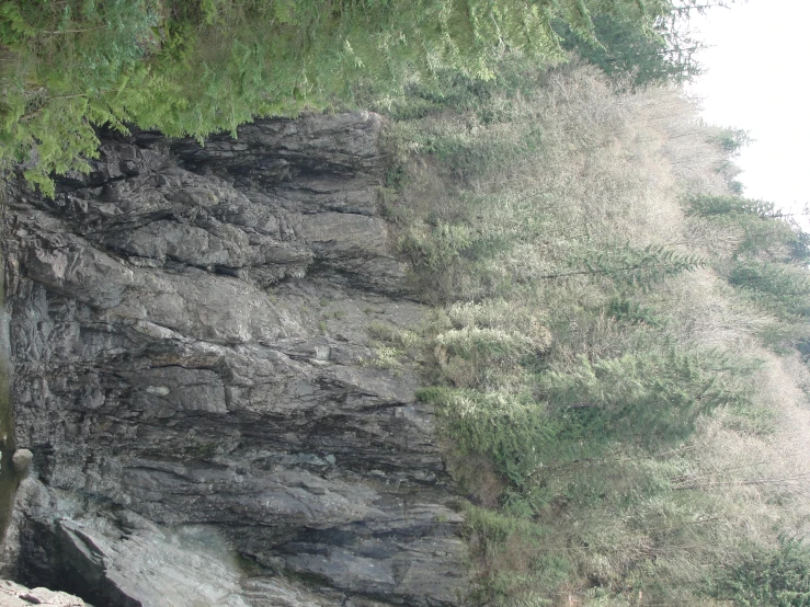 a black and white picture of rocks and a cliff