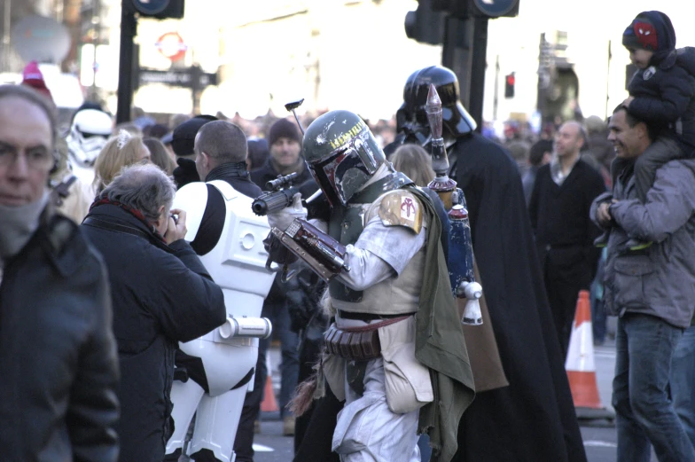 many people on the street with star wars costumes