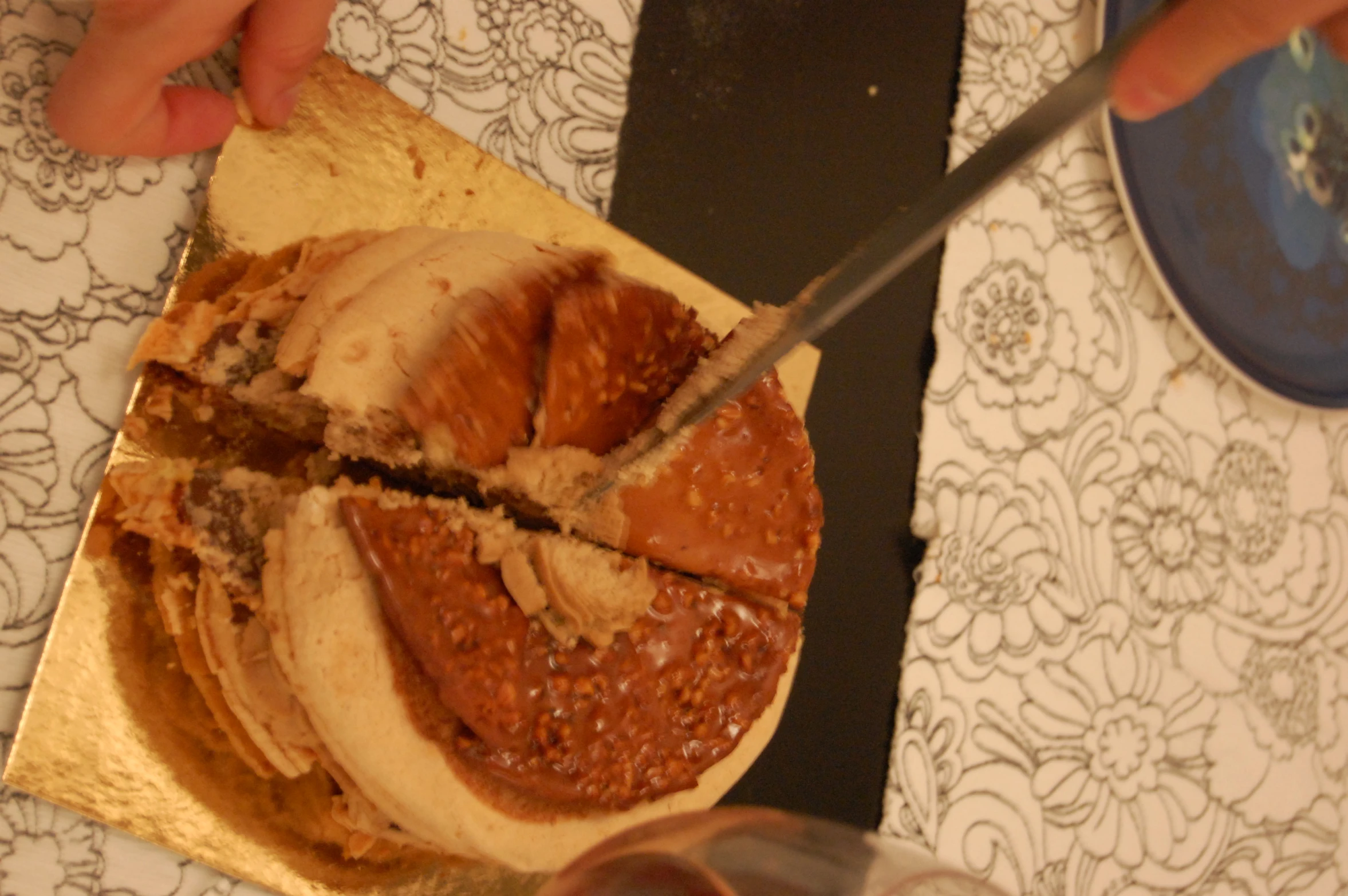 a person is  into some food on a wooden platter