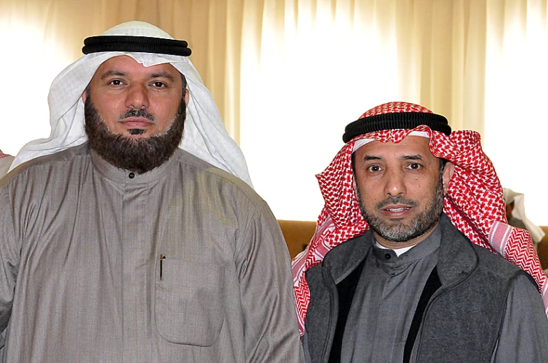 two men in traditional garb standing next to each other