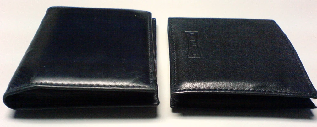 two dark black leather wrist wallets