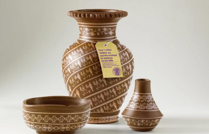 two brown vases sit next to each other