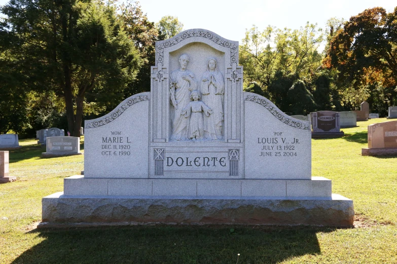 a cemetery with headstones and trees in the background