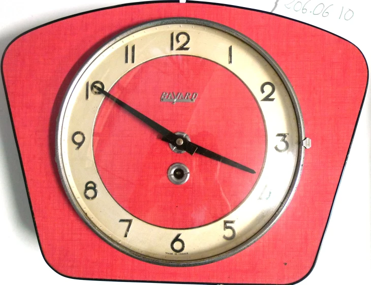 a red clock with numbers on each side of it