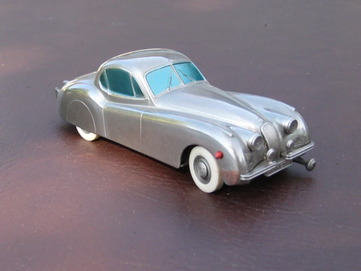 there is a silver car that is on the table