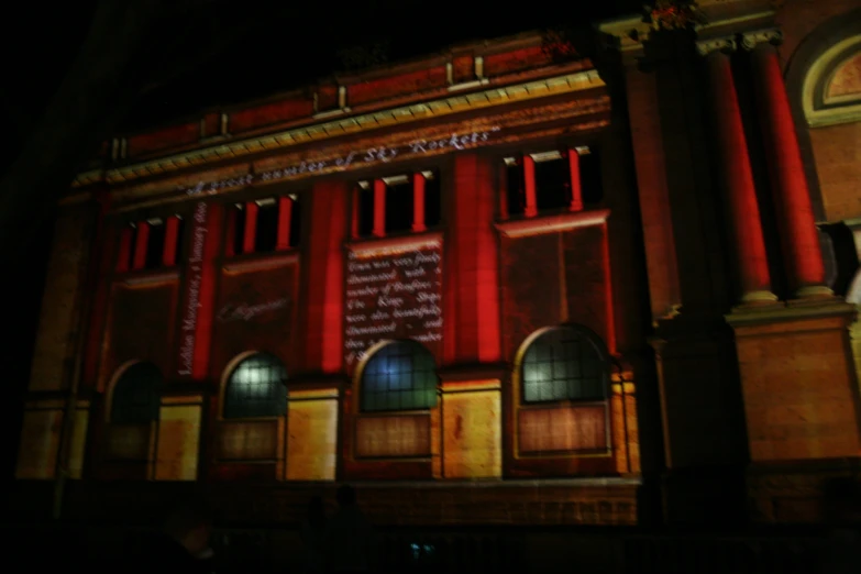 the building has red and gold trim around the windows