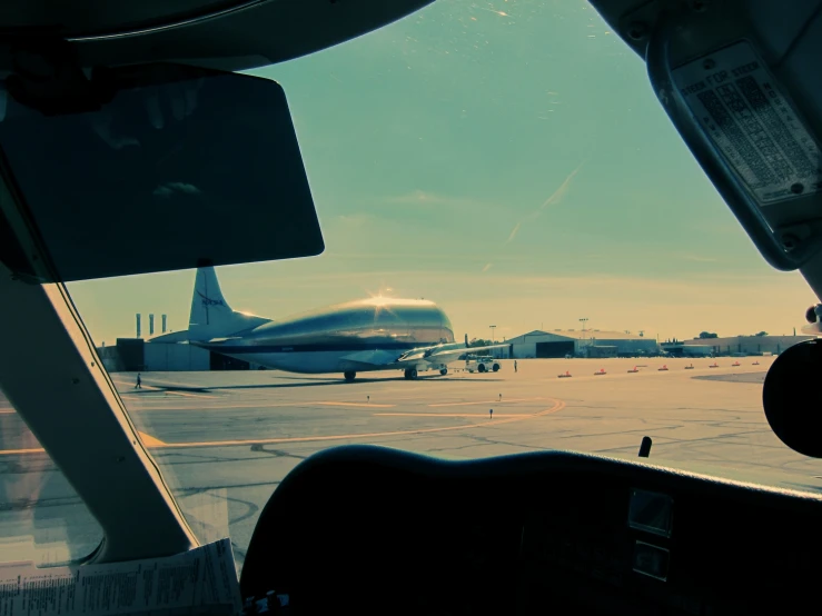 the plane is parked on the runway at an airport