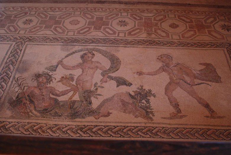 the mural is painted on a roman style tile floor