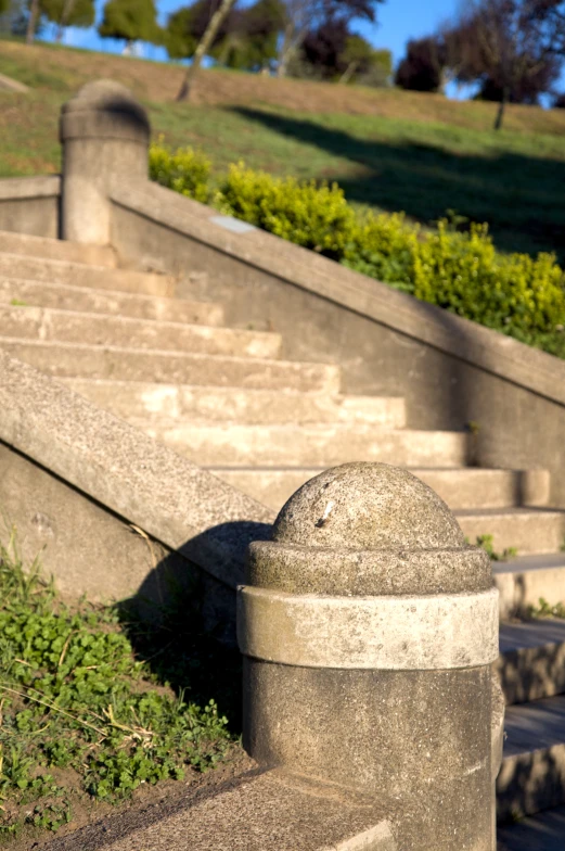 a stone hydrant sits between several steps