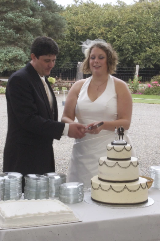 a man and woman  their wedding cake