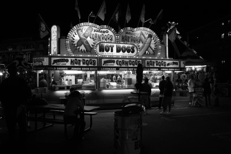 some people are on the carnival ride at night