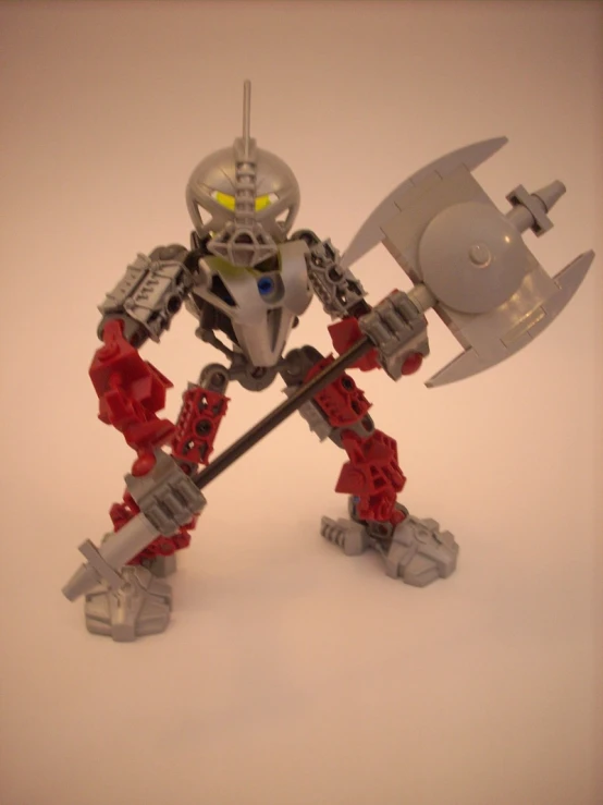 a toy robot with a big metal hammer