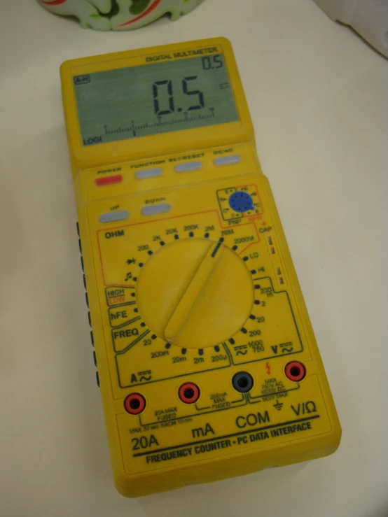 an old style multimeter sits on the table