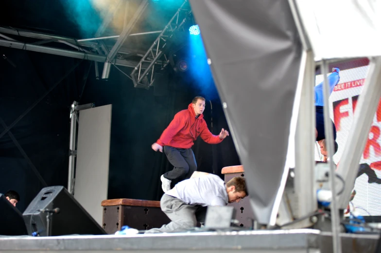 a guy doing a trick on a stage