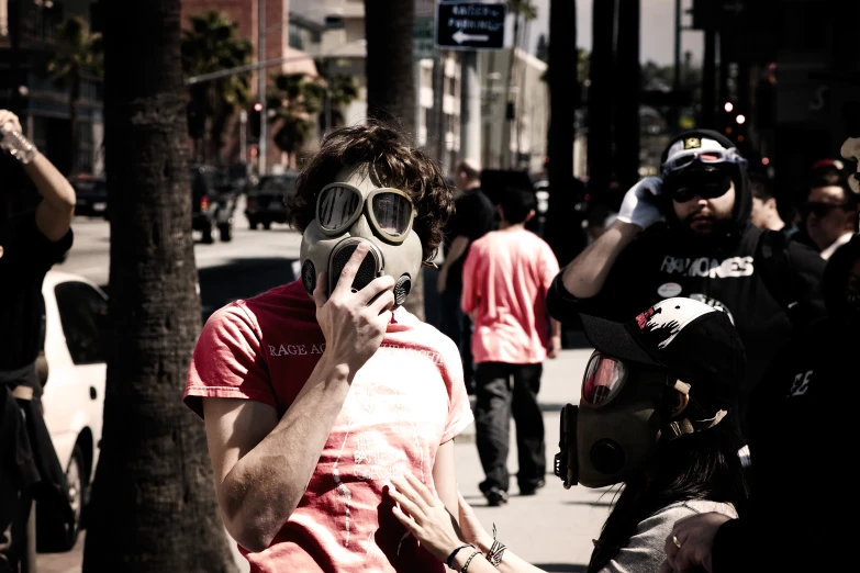 a man in a mask talking on a cell phone