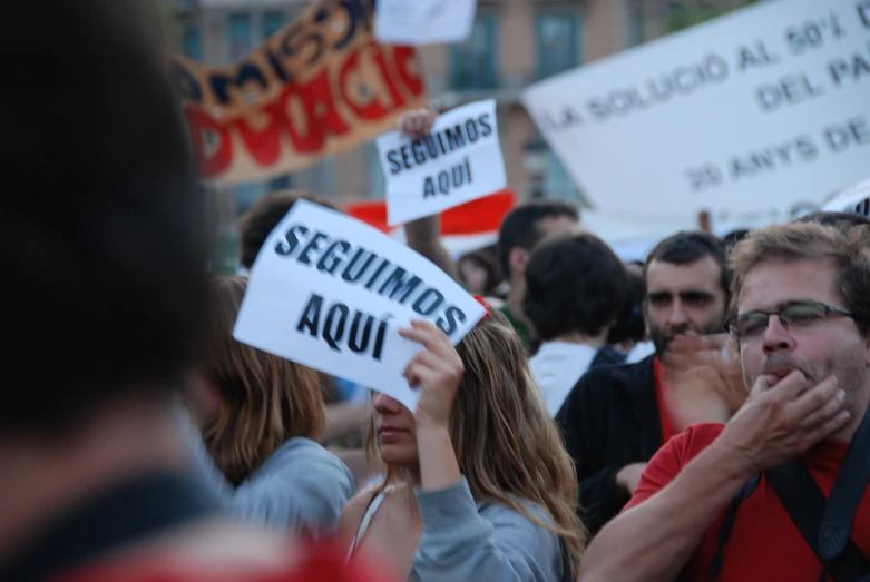 protestors holding signs on the streets during an important rally