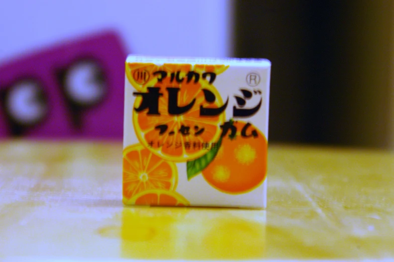 a small orange soap bar on a table