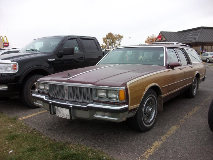 this is an older station wagon parked next to another one