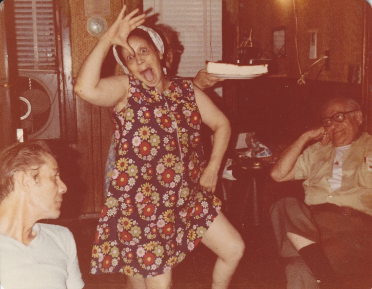 a woman in a floral dress plays with a plate