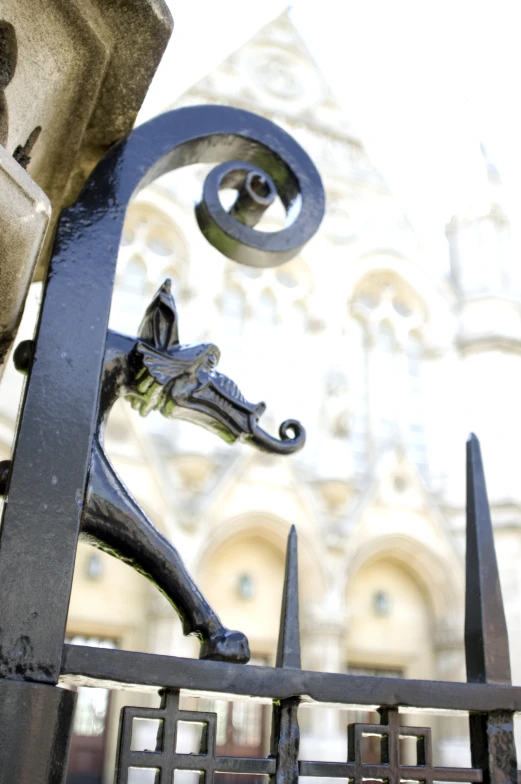 the metal horse sculpture is located by a building