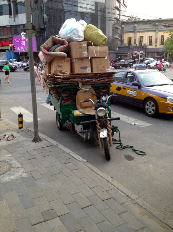 a motorcycle is loaded with cargo on a street