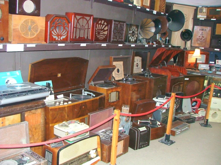 a room filled with old radio equipment on shelves