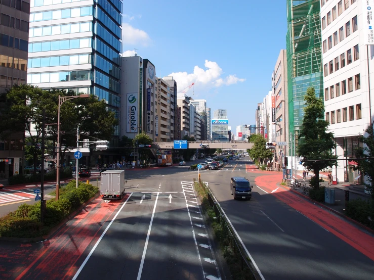 the empty street near a city with tall buildings